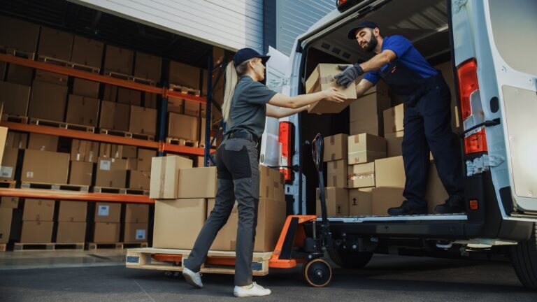 Warehouse team unloading boxes
